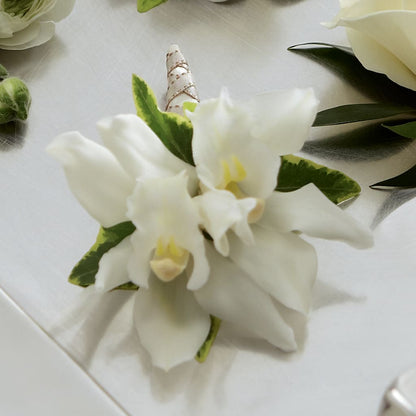 White Mini Cymbidium Boutonniere – MEME'S FRANKLIN FLOWER SHOP, Franklin LA